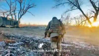 Russian soldiers running past destroyed M113 Gopro footage