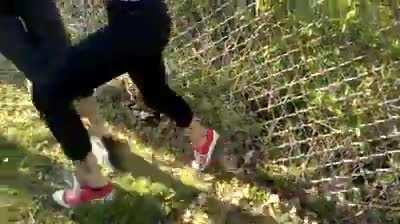 red Converse to the face