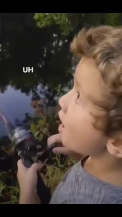 Boy fishing with his dad 