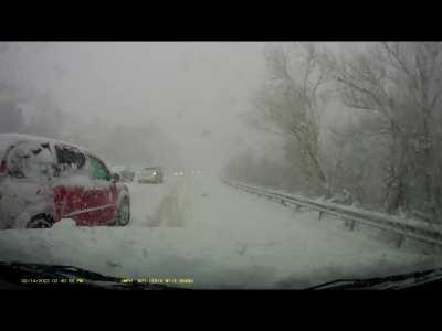 Idiot in red van decided the scene of an accident during a blizzard is a great time to pass.
