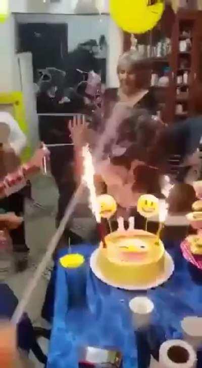 She becomes one with the birthday candles..