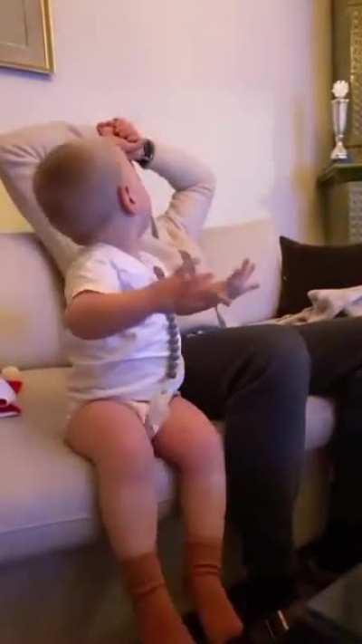 Watching the game with dad.