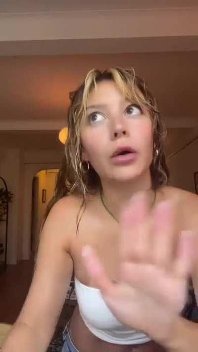 G Braless in a white top in her latest YouTube Short