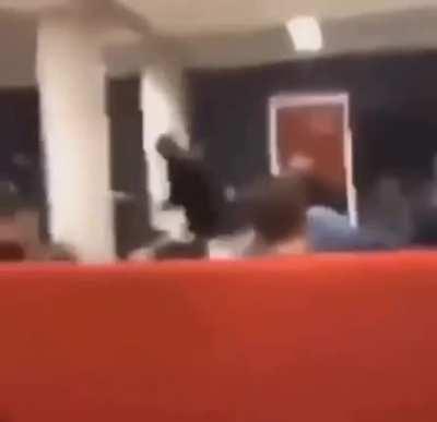 Pouring water on a strangers head