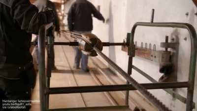 Rope maker's top is a wooden cone with four grooves in it. It is placed between the strands as they are twisted to keep the twist tight and even.