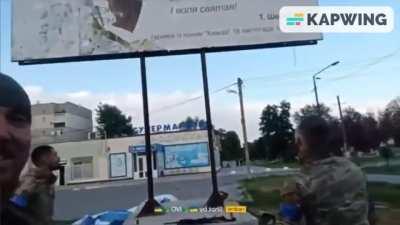 Ukrainian soldiers tear down a Russian propaganda banner in a liberated city and find a Taras Shevchenko poem under it