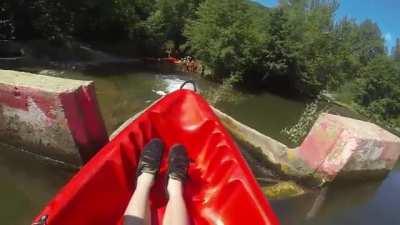 WCGW standing at the bottom of the kayak slide.