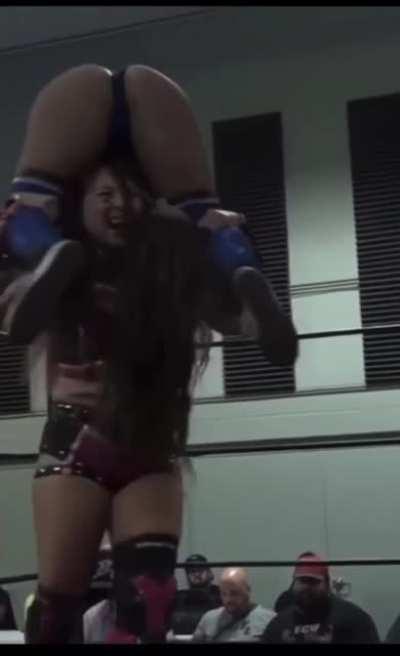 Skye Blue carried in a muscle buster