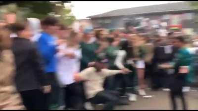 Michigan State students flipping a car after football win over Michigan