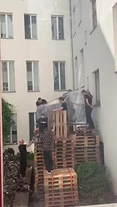 How does one get a piano into a room on the second floor of a house?