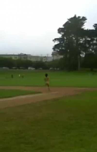 Guy records girlfriend doing a naked dare, streak around a baseball diamond with people near. She follows through, but look how embarrassed she is those men saw her nude, even from a distance