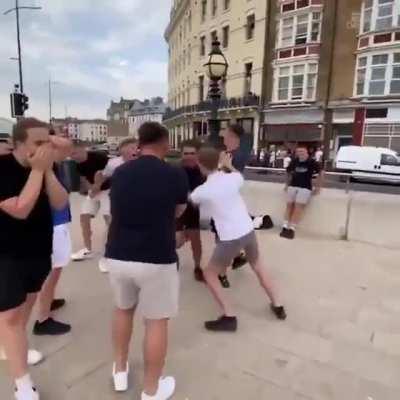 A girl makes a dribble and scores a goal