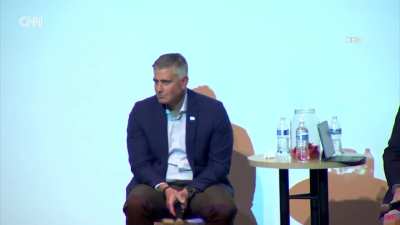 Americans defend Canadians and wave flag at town hall in Spokane, Washington