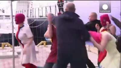 Pussy Riot attempts to perform anti-Putin song, Registered Cossacks are having none of it (Sochi, 2014)