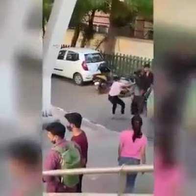 Hats off to the boy who took the cellphone from the girl to let them continue the fight!