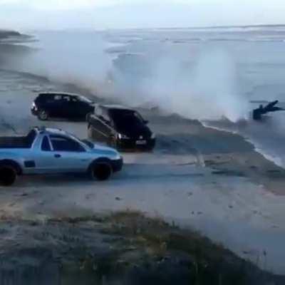 Riding a motorcycle through an approaching tide
