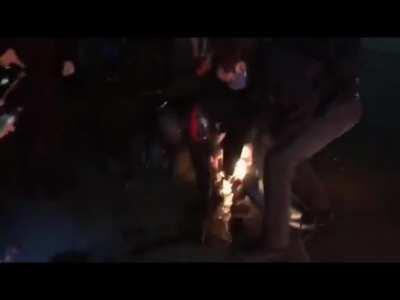 Portlands resident Antifa Clown 'Fire Shoes' does a dance for the crowd