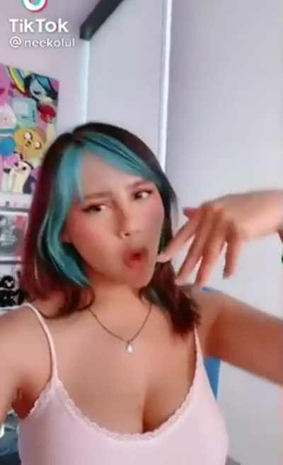 Her tits are looking so big and luscious in that white tank top.