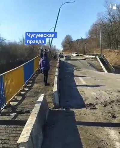 Crossing a bombed bridge in Ukraine