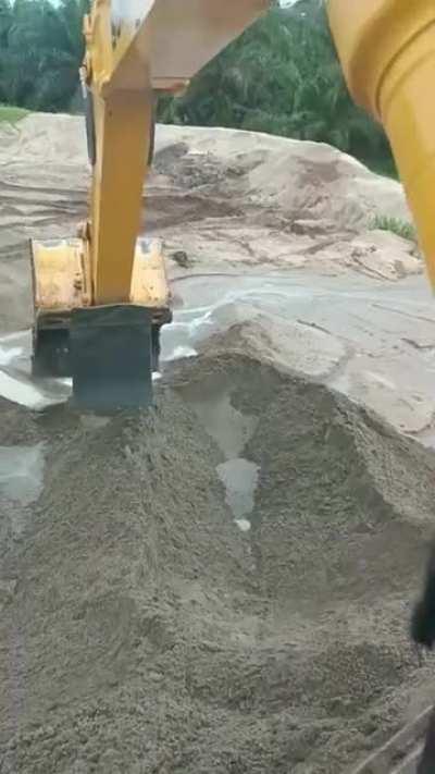 Splashing friend with excavator.