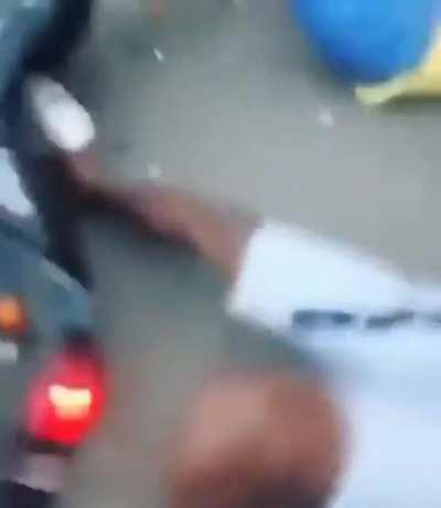 Wheeling towards a girl standing on the middle of a road.