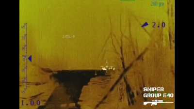 Ukrainian Sniper Group E40 target a Russian infantry group and hit 2 Russian soldiers with American Barrett MRAD sniper rifle from a distance of (claimed) ~1150 meters at night. Published 18.10.2025