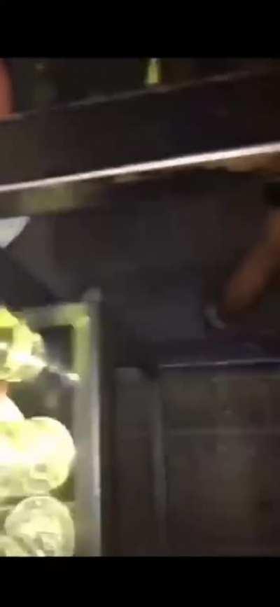 Woman pisses into a glass