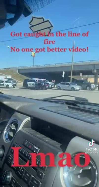 idiot drives directly into line of fire