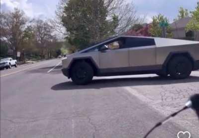 Cybertruck driver rages at kids on bikes, calls them homophobic slurs, threatens to rip off their heads and spit down their throats; suggests the kids are just mad at Elon Musk