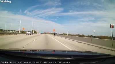Biker falls off highway after colliding with other biker