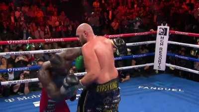 Fury ducks under Wilder's hook then drops him as he is left exposed