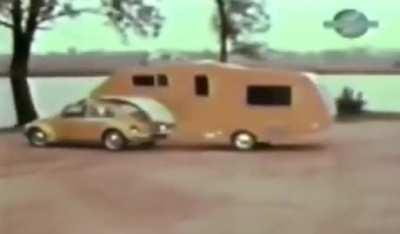 In 1974, owners of Volkswagen Beetles were encouraged to buy this trailer add-on that provided a small living space that can attach to the vehicle.