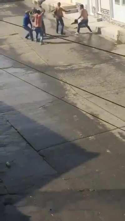 Men armed with machetes fight on the streets of Colombia part 2