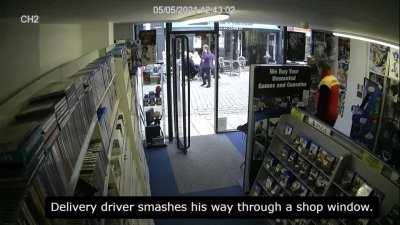 Delivery driver smashes his way through a shop window