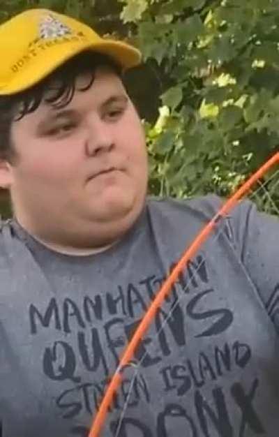 Guy showing off his fishing rod