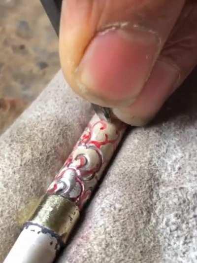 Silver engraving techniques.