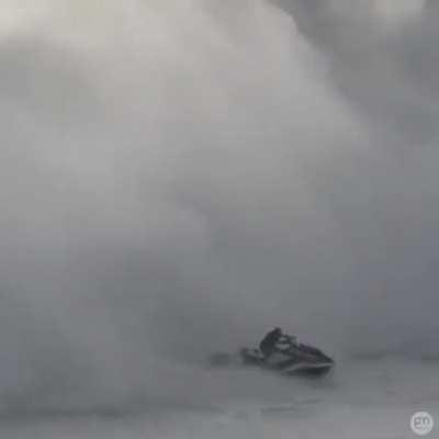 Jet ski driver saves a guy from a big wave
