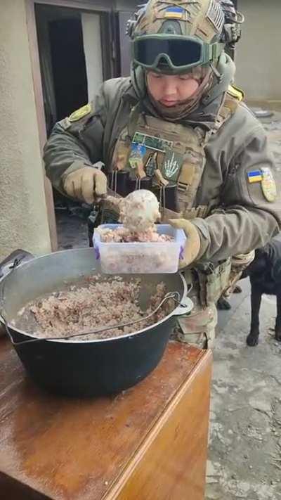 This defender of Ukraine is still making sure all the dogs are fed