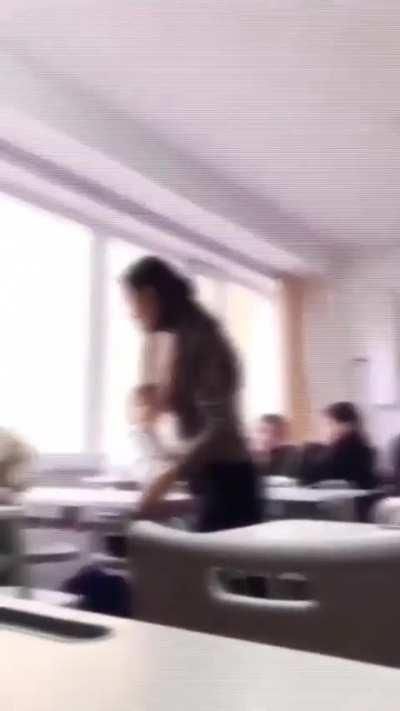 teacher try to stop student fight