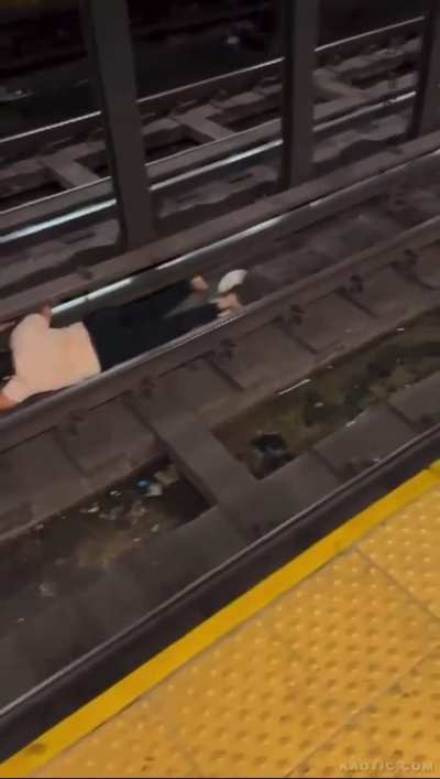 Man On Train Tracks Electrocuted After Touching The Third Rail & One Of The Running Rails At The Same Time In An NYC Subway (NSFW)  