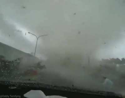 Tornado forms on car