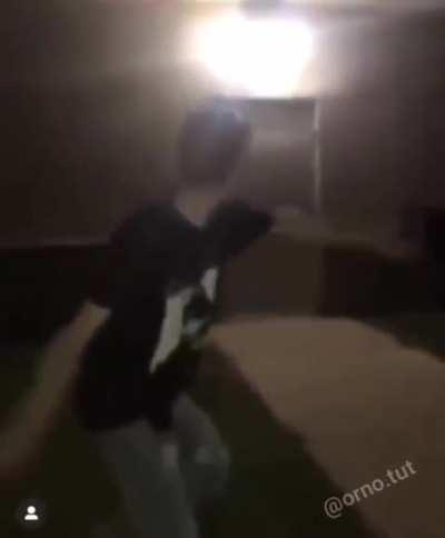 Throwing a bottle on the wall.