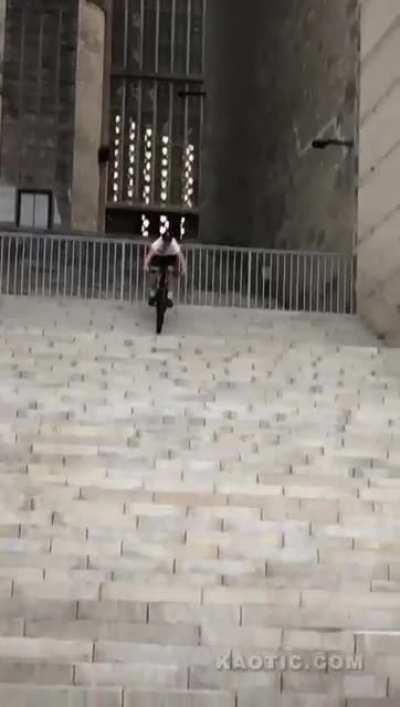 To ride down a flight of stairs without a helmet