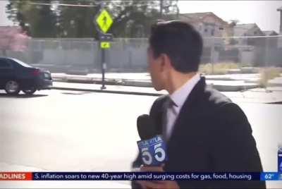 Driver gets into a crash during a news report and drives away as his front plate falls off