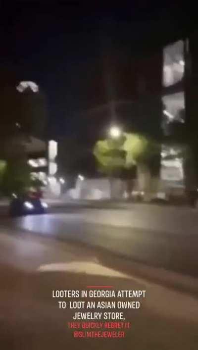 Asian store owner defends his turf