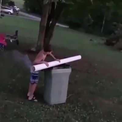Kid shoots firework to light a bonfire
