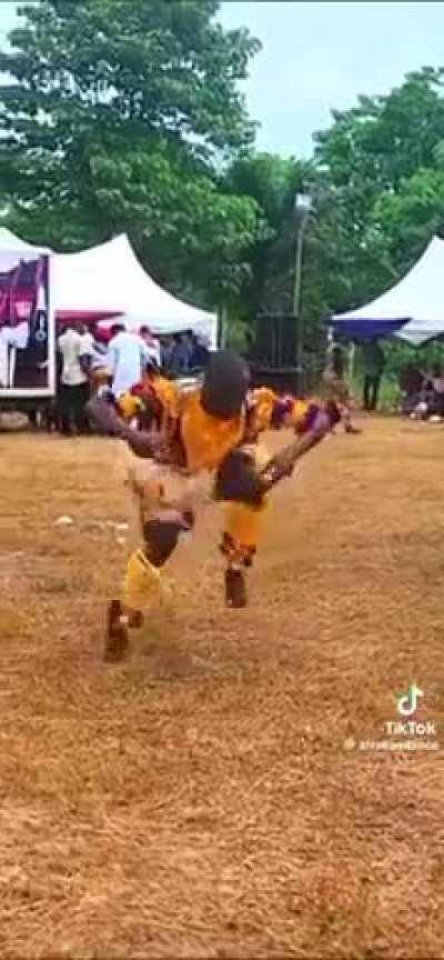 Feet in a frenzy! This dancer's footwork is a whirlwind of cultural fire.
