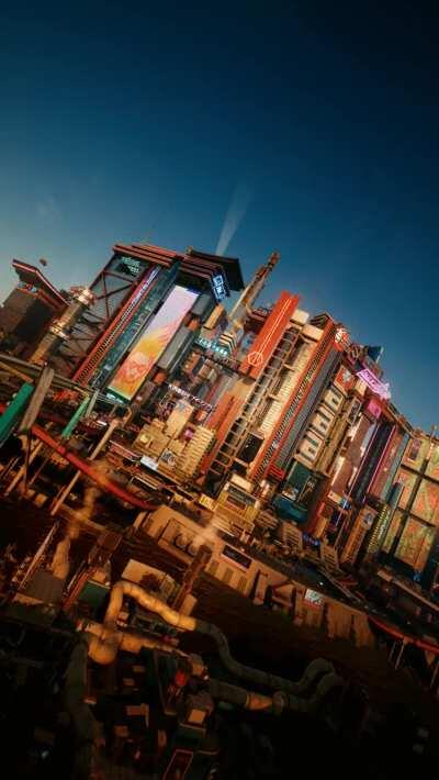 I took 24 pictures of Night City at the exact same location but at each hour and turned it into my new phone wallpaper!