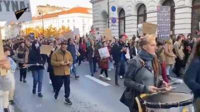 people in Poland march in solidarity with the Palestinian people.