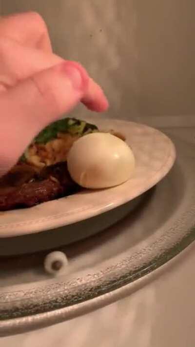 Microwaving an egg for 2 minutes